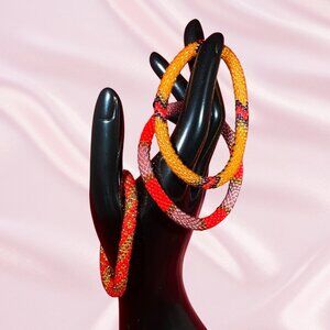 NEW never worn Sashka Bracelets - Orange and Red